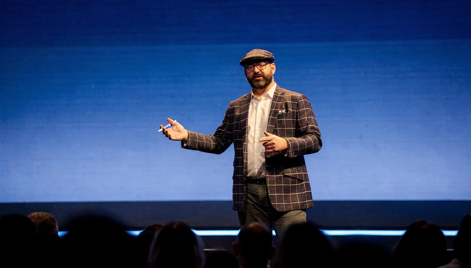 Paul Swaney delivering a keynote on stage